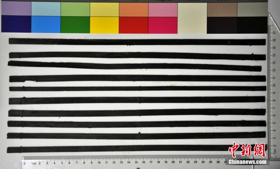 圖為漢代簡牘出土930支竹簡，在四川地區(qū)首次發(fā)現(xiàn)漢代簡牘。